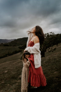 mother and child sharing tender moment in dramatic sonoma county